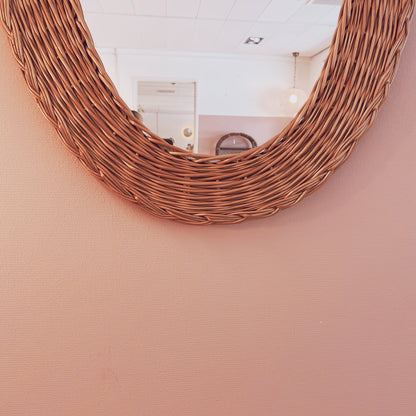 Decorative oval rattan mirror