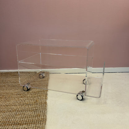 Lucite sidetable with magazineholder on wheels