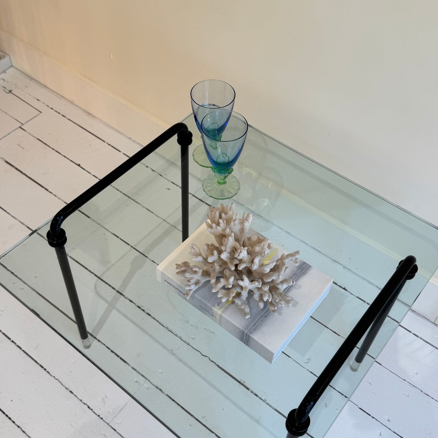 Italian glass side table with black metal frame