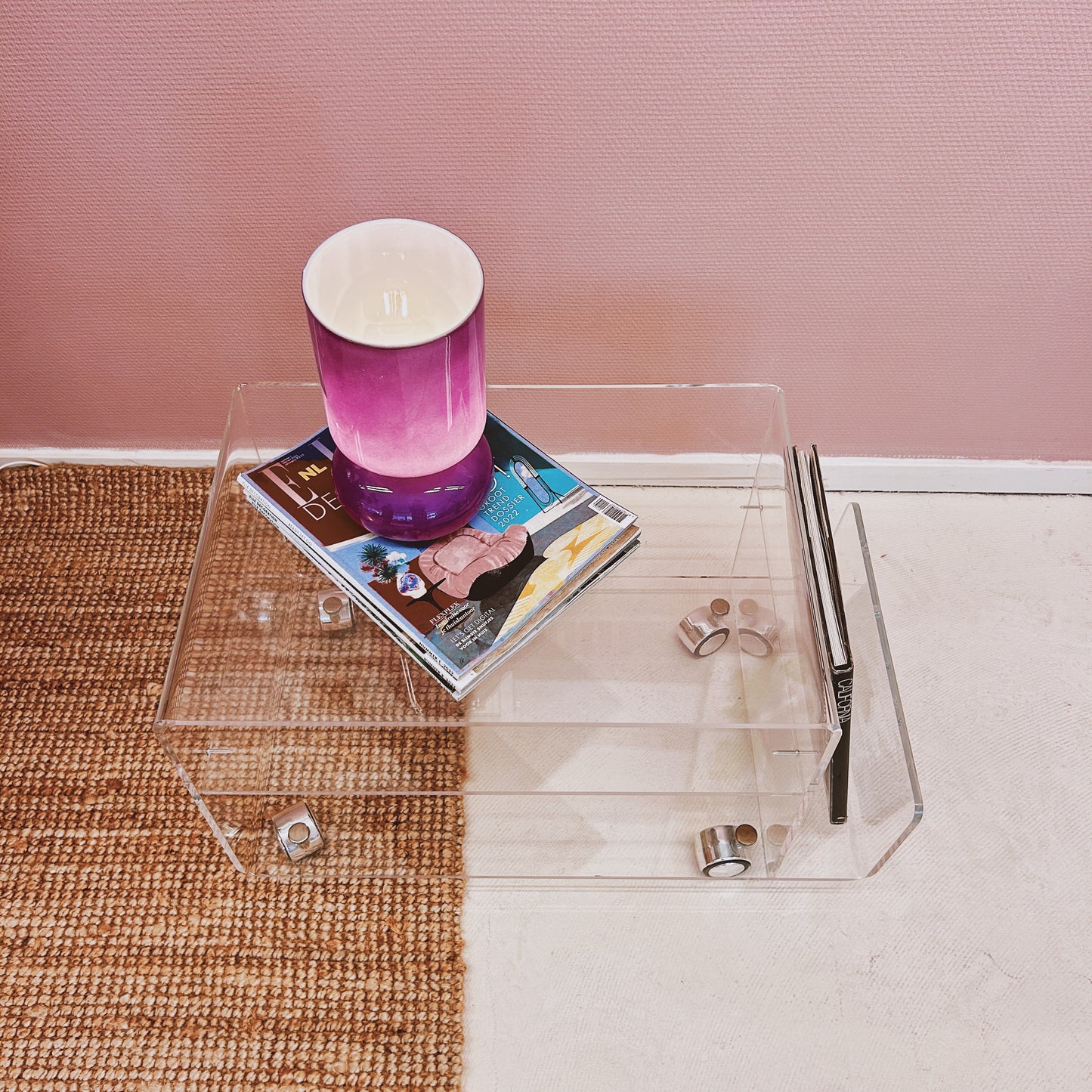 Lucite sidetable with magazineholder on wheels