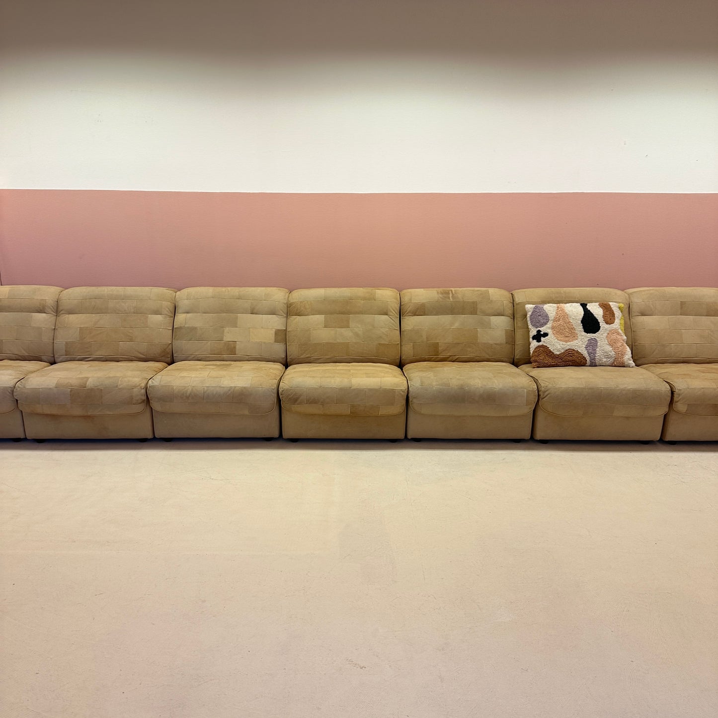 Modular beige leather patchwork sofa