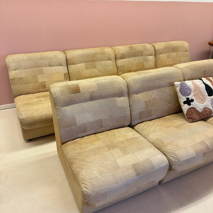 Modular beige leather patchwork sofa