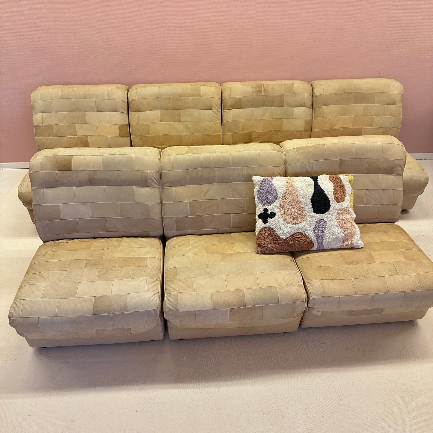 Modular beige leather patchwork sofa