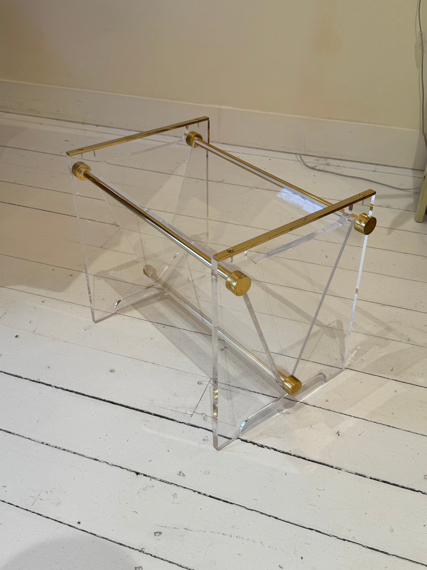 Mid-century plexiglas magazine with brass details