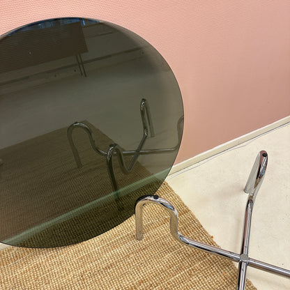 Curved tubular chrome coffee table with round glass top