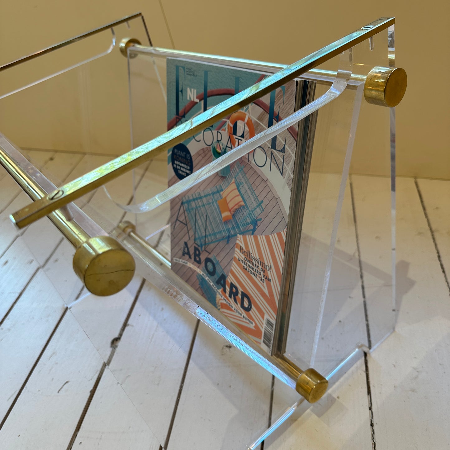 Mid-century plexiglas magazine with brass details